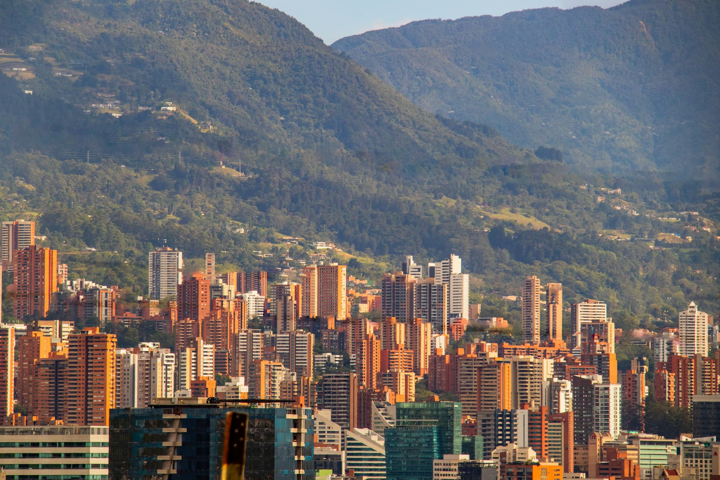 View of Medellín: the city's buildings with the mountains behind